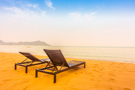 Beautiful beach and sea with empty chair on tropical beach - Filter effect and boost up color Processingの写真素材
