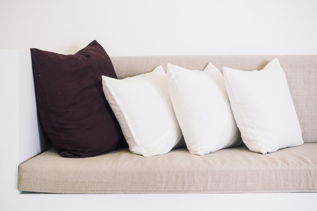 Beautiful luxury pillow on sofa decoration in living room interior - Vintage light Filterの写真素材