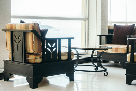 Beautiful luxury pillow on sofa decoration in living room interior - Vintage Light filterの写真素材