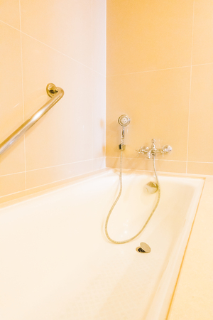 Beautiful luxury bathtub decoration in bathroom interior - Vintage Light Filterの写真素材