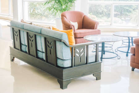 Beautiful luxury pillow on sofa decoration in living room interior - Vintage Light filterの写真素材