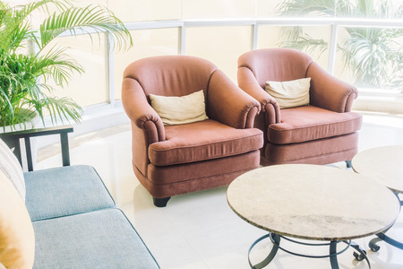 Beautiful luxury pillow on sofa decoration in living room interior - Vintage Light filterの写真素材