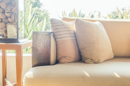 Beautiful luxury Pillow on sofa decoration in living room interior - Vintage light Filterの写真素材