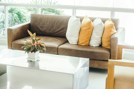 Beautiful luxury pillow on sofa decoration in living room interior - Vintage Light filterの写真素材