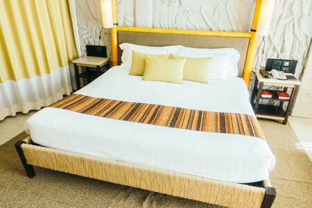 Beautiful pillow on luxury bed in bedroom interior - Vintage Light Filterの写真素材