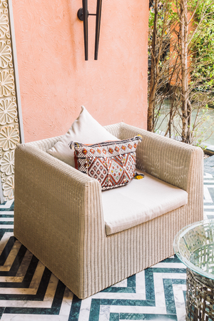 Beautiful luxury pillow on sofa decoration in living room interior - Vintage Light Filterの写真素材