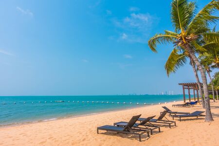 Beautiful tropical beach and sea with palm tree - Boost up color Processingの写真素材