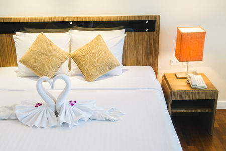 Beautiful luxury pillow on bed decoration in bedroom interior - Vintage Light Filterの写真素材