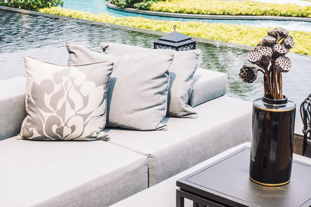 Beautiful luxury modern Pillow on sofa and chair decoration around outdoor patio - Vintage Light Filterの写真素材