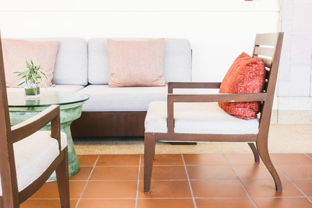Pillow sofa and chair decoration in livingroom interior - Vintage Light Filterの写真素材