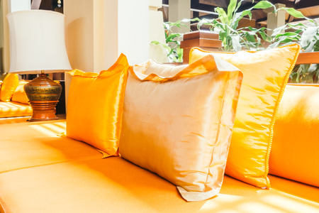 Empty wooden sofa with pillow and chair decoration in living room interior - Vintage Filterの写真素材