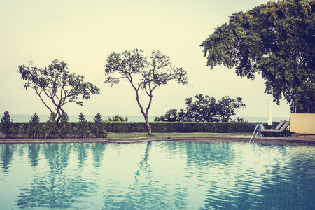 Beautiful luxury outdoor swimming pool in hotel resort - Vintage Filter