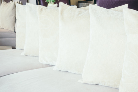 Beautiful luxury pillow on sofa decoration in living room interior - Vintage Light filter