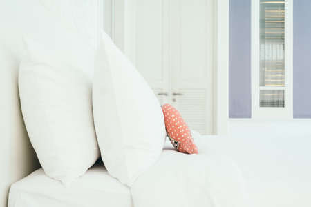Beautiful luxury white pillow on bed decoration in bedroom interior - Vintage Light Filterの写真素材