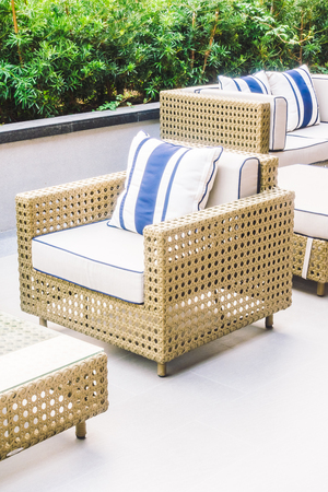 Sofa pillow and chair decoration with outdoor patio - Vintage Light Filterの写真素材