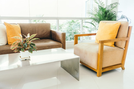 Beautiful luxury pillow on sofa decoration in living room interior - Vintage Light filterの写真素材