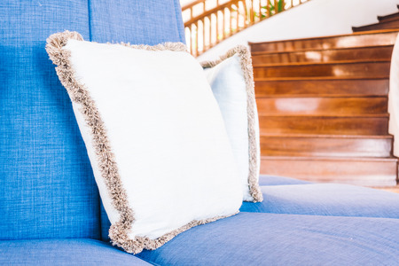 Beautiful luxury pillow on sofa and chair decoration in living room interior - Vintage Light Filterの写真素材