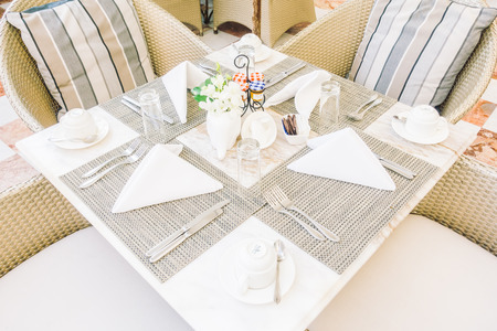 Empty table and chair setting for dinning in restaurant - Vintage Light Filter