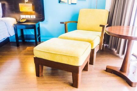 Empty sofa and chair decoration in bedroom interior - Vintage Light Filterの写真素材