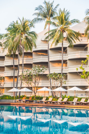Beautiful luxury outdoor swimming pool with umbrella and chair in hotel pool resort - Vintage light Filterのeditorial素材