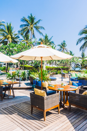 Outdoot patio with pillow on sofa and chair on the beach and sea - Vintage Light Filterのeditorial素材