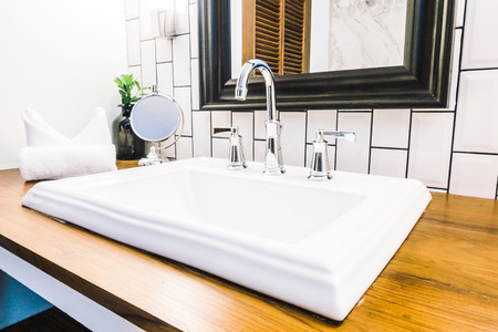 Beautiful luxury white sink decoration in bathroom interior - Vintage Light Filterの写真素材