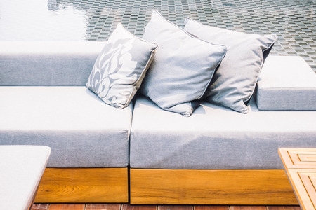Beautiful luxury modern Pillow on sofa and chair decoration around outdoor patio - Vintage Light Filterの写真素材
