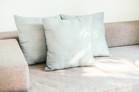 Pillow on sofa and chair decoration in living room interior - Vintage Light Filterの写真素材