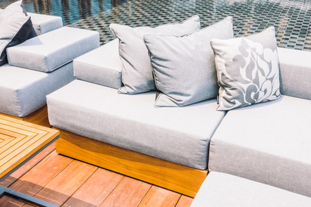 Beautiful luxury modern Pillow on sofa and chair decoration around outdoor patio - Vintage Light Filterの写真素材
