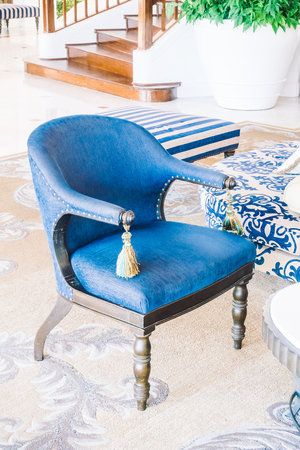 Beautiful luxury pillow on sofa and chair decoration in living room interior - Vintage Light Filterの写真素材