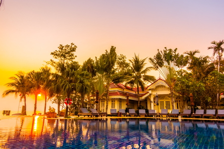 Beautiful luxury umbrella and chair around swimming pool in hotel resort at Sunset times - Vintage Filter and Boost up Color Processingのeditorial素材