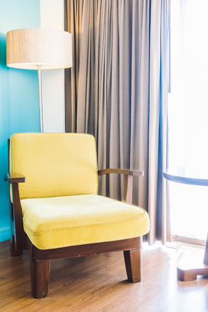 Empty sofa and chair decoration in bedroom interior - Vintage Light Filterの写真素材