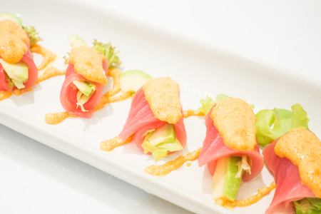 Selective focus point on Tuna roll sushi with avocado - Japanese food styleの写真素材