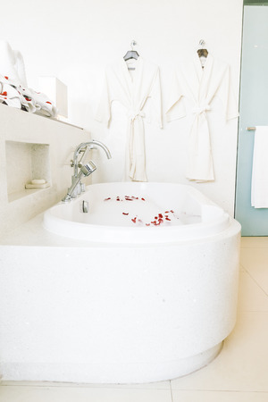 Beautiful luxury white bathtub decoration in bathroom interior - Vintage light Filterのeditorial素材
