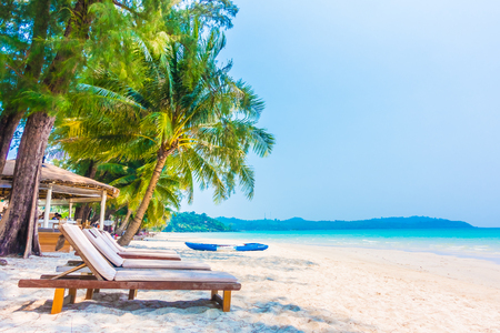 Beautiful tropical ocean or sea and sand beach on island with coconut palm tree - Boost up color Processing styleのeditorial素材