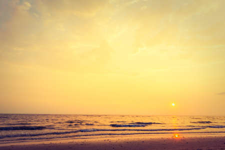 Beautiful sunset with sky and cloud on the beach and seascape - Vintage Filter and Boost up color Processingの写真素材