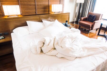 Messy and sheet white pillow decoration on bed - Vintage light Filterのeditorial素材