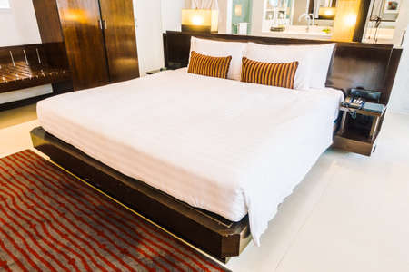 Beautiful luxury pillow on bed decoration in bedroom area interior - Vintage light Filterのeditorial素材