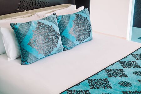 Beautiful luxury Pillow on bed decoration in bedroom interior - Vintage Light Filterの写真素材