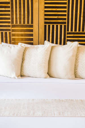 Beautiful luxury pillow on bed decoration in bedroom interior - Vintage light Filterの写真素材