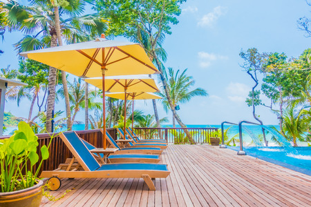 Beautiful luxury umbrella and chair around swimming pool in hotel resortのeditorial素材