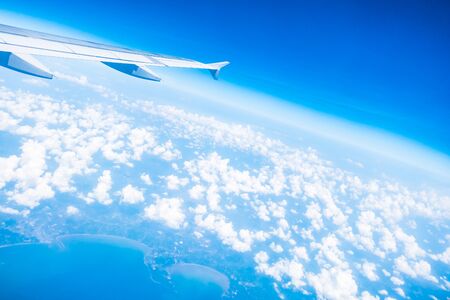 Airplane wing on beautiful blue sky with cloud background - Boost up color Processing