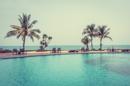Beautiful luxury outdoor swimming pool in hotel resort - Vintage Filter and Boost up color Processingの写真素材