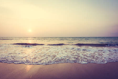 Beautiful sunset on the tropical beach and sea landscape - Vintage filter and Boost up color Processingの写真素材