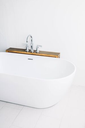 Beautiful luxury white modern bathtub decoration in bathroom interior - Filter effectの写真素材