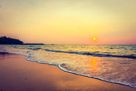 Beautiful sunset on the tropical beach and sea landscape - Vintage filter and Boost up color Processingの写真素材