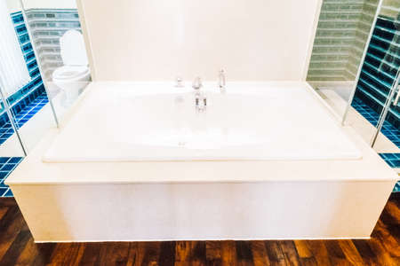 White beautiful luxury bathtub decoration in bathroom interior - Vintage light Filterの写真素材