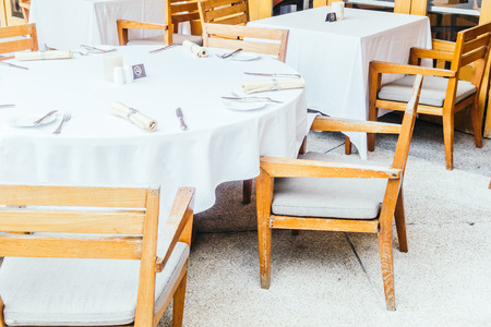 Empty Chair and table setting for dinner in restaurant - Vintage Light Filterの写真素材