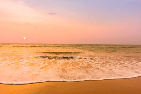 Beautiful sunset on the tropical beach and sea landscape - Vintage filter and Boost up color Processingの写真素材