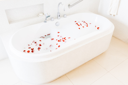 Beautiful luxury white bathtub decoration in bathroom interior - Vintage light Filterのeditorial素材